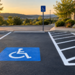 ADA accessible parking space with wheelchair symbol, striped access aisle and sign on a Springfield MO commercial lot