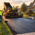 professional asphalt paving crew laying a new driveway in Springfield MO